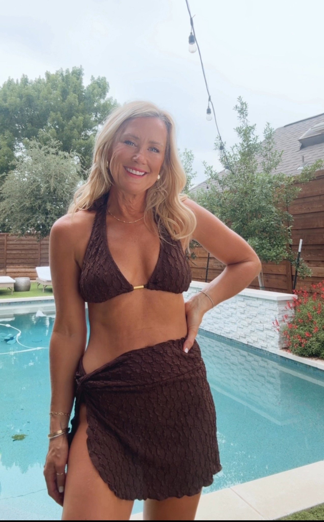 This classic bikini actually covers all the lady parts (low rise bottoms, but full coverage in the back!)! Love the textured material & gold detail on the top. Fully lined, and comes with the cute skirt coverup. I’m in a small 

Code CASSIE15 saves you 15% off $70 & CASSIE20 saves $20 off $109 🥳

@cupshe #cupshepartners 

#LTKOver40 #LTKFindsUnder50 #LTKSwim