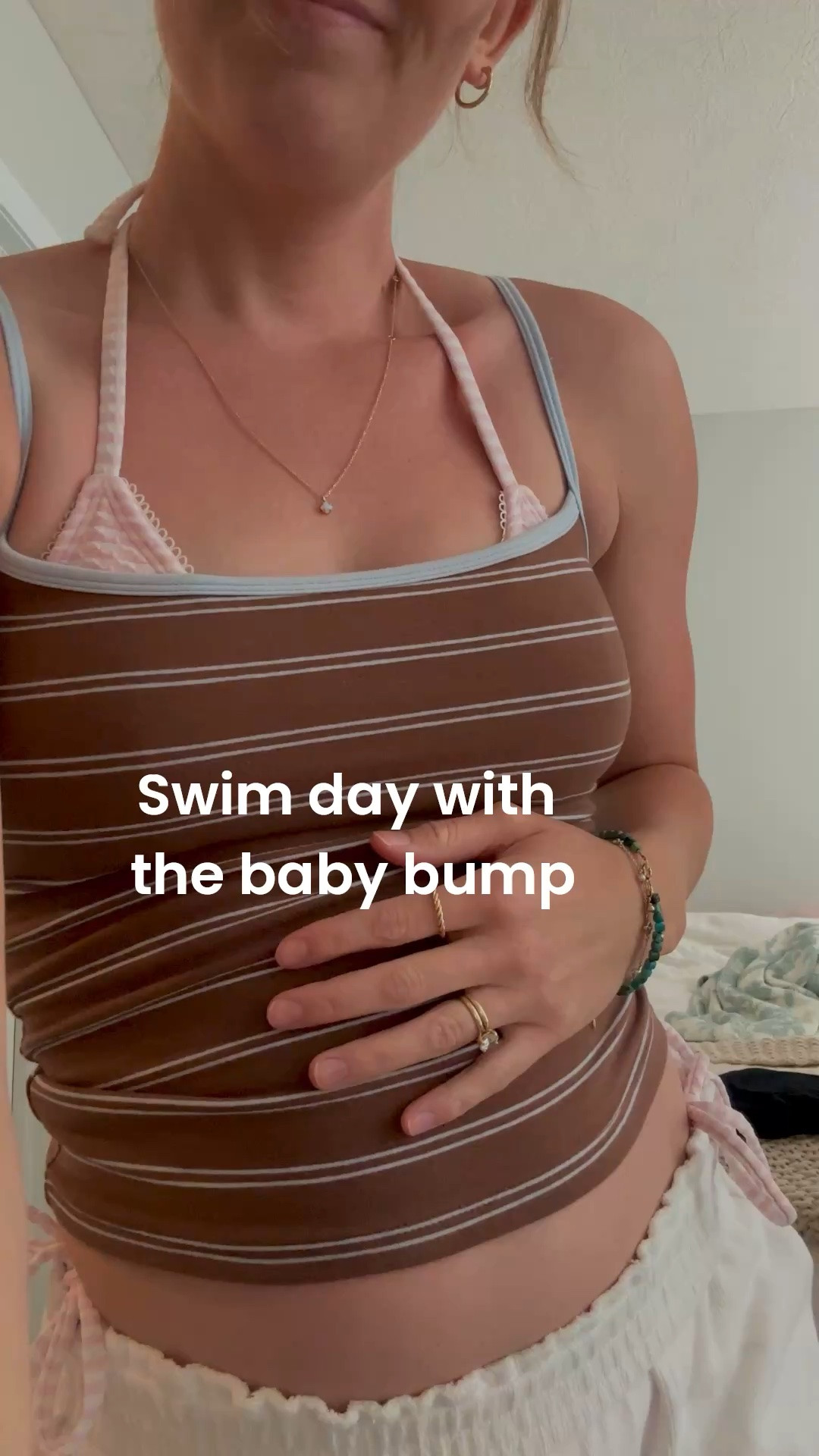Small in top. Small in swimsuit top. Medium swim bottoms. Medium in white pants. 

Pregnancy outfit. Summer pregnancy outfit. Swimsuit pregnancy. Comfy pregnancy outfit. Summer. Striped tank top. White linen pants.

#LTKBump #LTKBaby