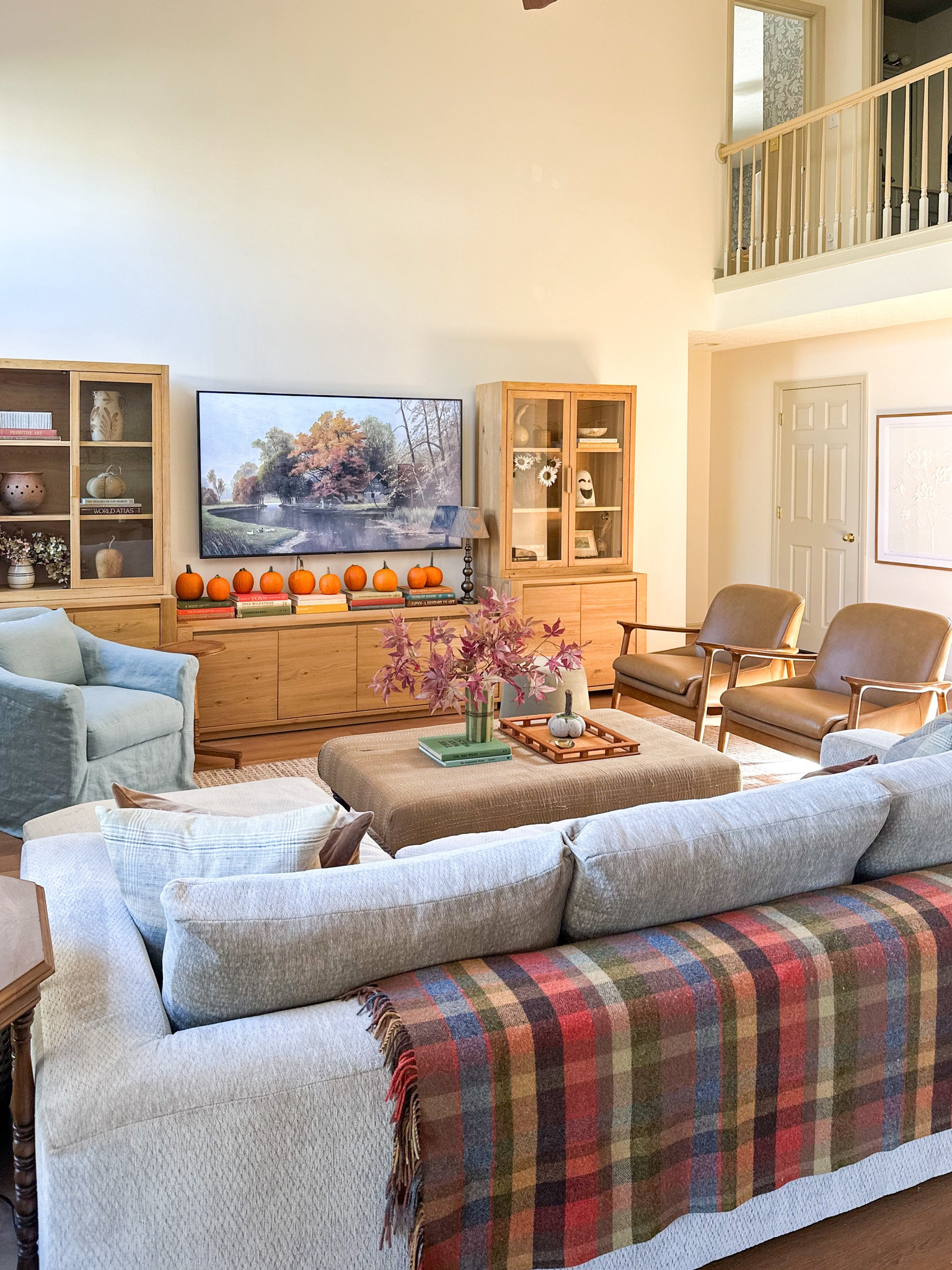 TV Media Console - sideboards with glass door hutch. Swivel skirted linen chair, leather chairs, plaid wool 

#LTKHalloween #LTKHome #LTKSaleAlert