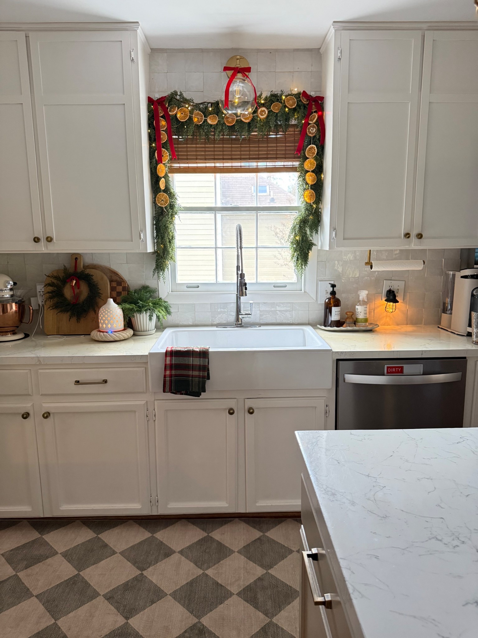 Classic Christmas kitchen styling with window garland 

#LTKHome #LTKHoliday #LTKSeasonal