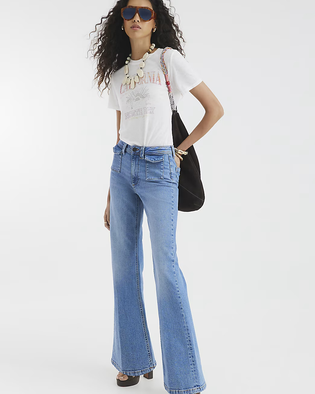Blue High Rise Relaxed Flare Jeans | River Island UK & IE