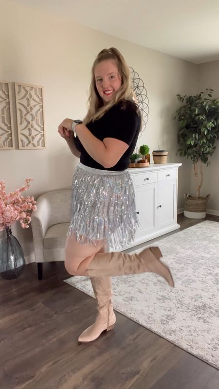 Taylor Swift concert Eras Tour outfit idea. ✨ Super cute silver fringe sequin skirt to shimmer all night! You probably even have a simple black bodysuit home already. Throw on some cowboy boots and your outfit is complete!

Space cowboy / western boots / sequin fringe skirt / Taylor Swift Concert outfit / country concert / cowgirl boots 

#LTKcurves #LTKunder50 #LTKunder100
