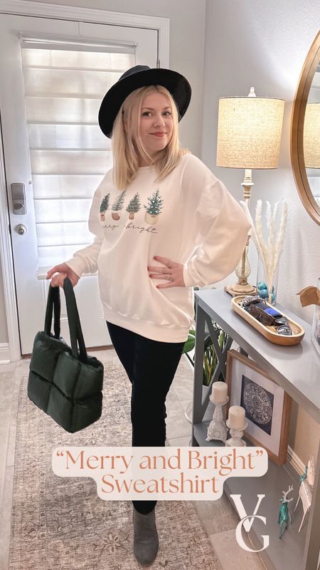 This oversized, holiday sweatshirt is super comfy and casual! It’s easy to throw on over leggings when you need to run a quick errand. 🏃🏼‍♀️

Or you could pair it with black pants and a few cute accessories like I did here. 
The white sweatshirt makes for a casual outfit for meeting up for a December lunch. I love how it says “Merry and Bright” 🌟 

#HolidaySweatshirt #WinterWear #ChristmasSweatshirt #Casual #ChristmasCasual #HolidayCasual #PuffPurse #MerryAndBright #MerryChristmas

#LTKfindsunder50 #LTKSeasonal #LTKHoliday