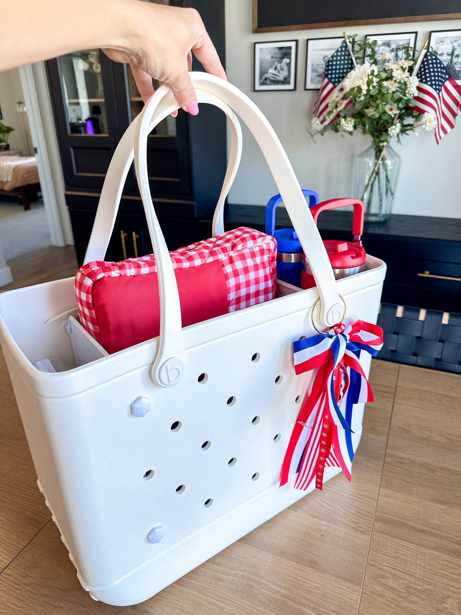 My 4th of July Bogg Bag is packed and ready for the parade! Whether you’re heading to a Fourth of July parade, fireworks show, or a day at the park, this bag is the perfect catch-all for everything you’ll need to stay comfortable, prepared, and festive.
Here’s what I packed in my patriotic parade bag:
	•	Sunscreen and bug spray
	•	Hats and sunglasses
	•	Refillable water bottles
	•	Glow sticks and flags for the kids
	•	Snacks and handheld fans
	•	Small blanket for sitting curbside
	•	Mini first aid kit (just in case)
I love using my Bogg Bag for 4th of July events because it’s easy to clean, fits everything I need, and holds its shape no matter how much I stuff inside. It’s my go-to for all things summer, especially when I need to be parade-ready and organized.

Bogg Bag essentials, 4th of July parade prep, patriotic bag, Independence Day celebration, summer bag must-haves, family parade gear, red white and blue bag, organized parade day, festival bag packing list, outdoor celebration essentials

#LTKSummerEdit #LTKFamily #LTKSeasonal