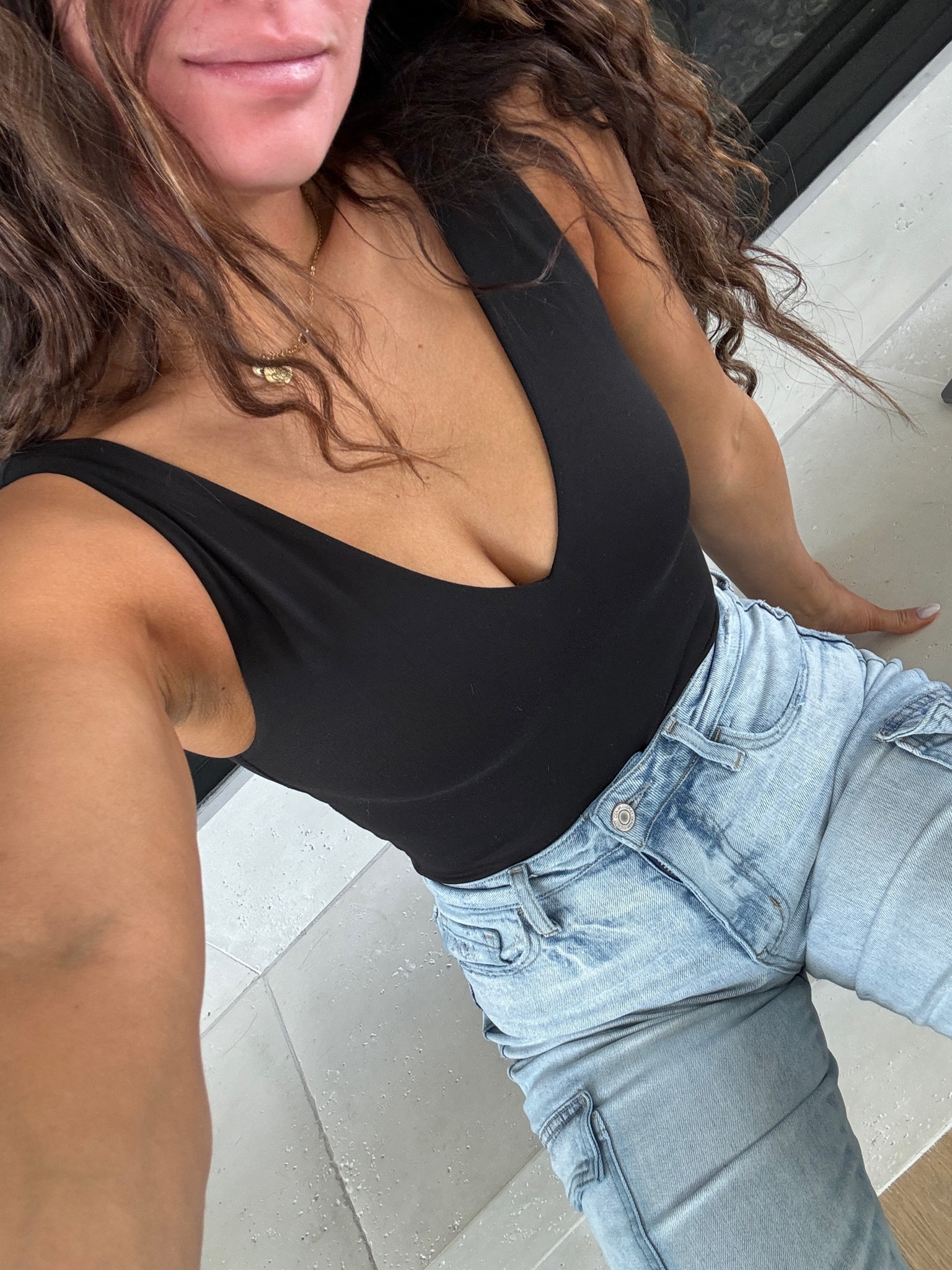 Obsessed with this Vuori bodysuit. I am wearing a size small. I have it in 3 colors. These jeans I sized down 1 are so flattering and comfy. My crimper is such a staple!

#LTKsalealert #LTKhome #LTKstyletip