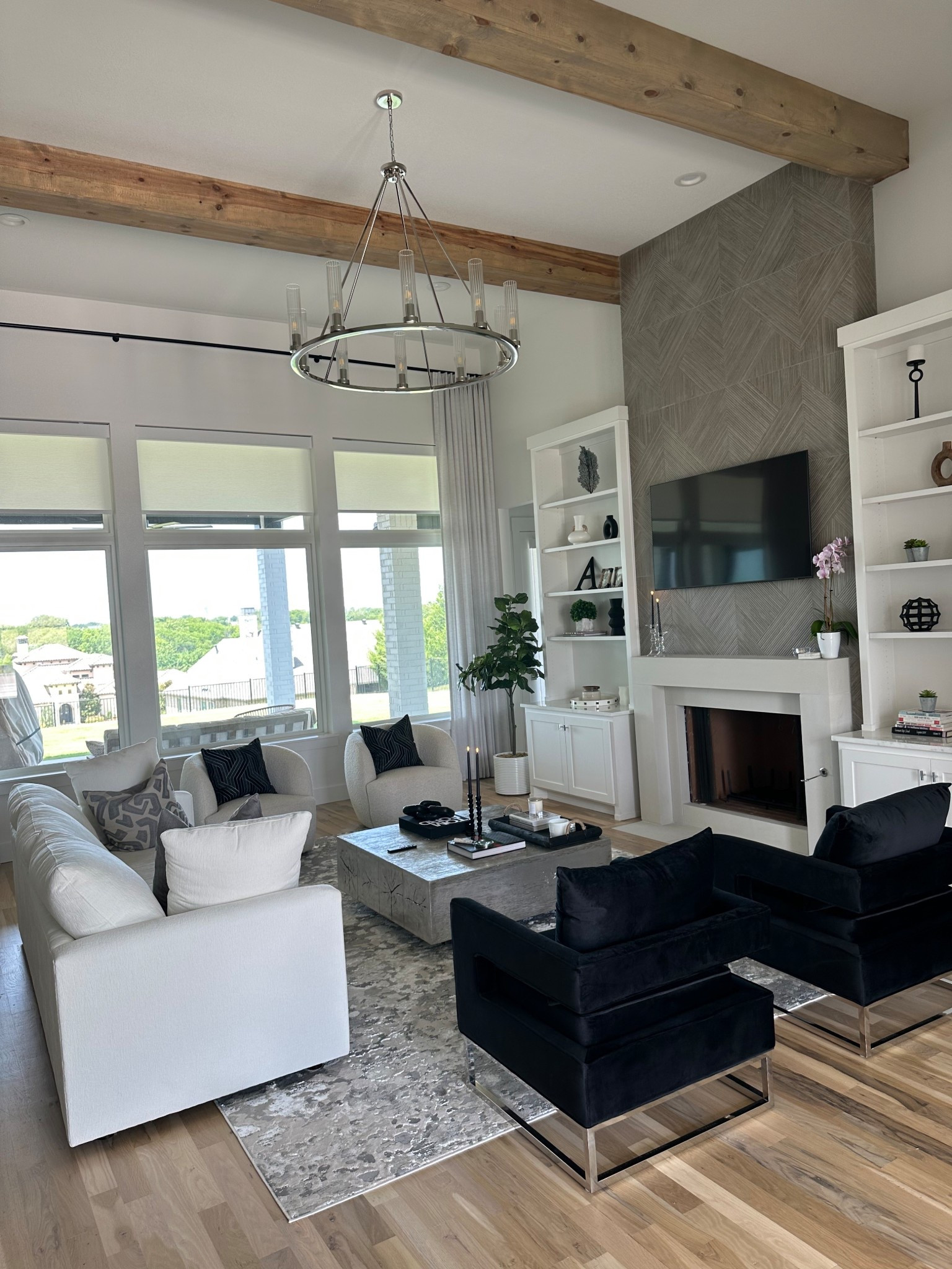 My fireplace tile that looks like wood and my black velvet chair and white couch. Living room decor 

#LTKHome