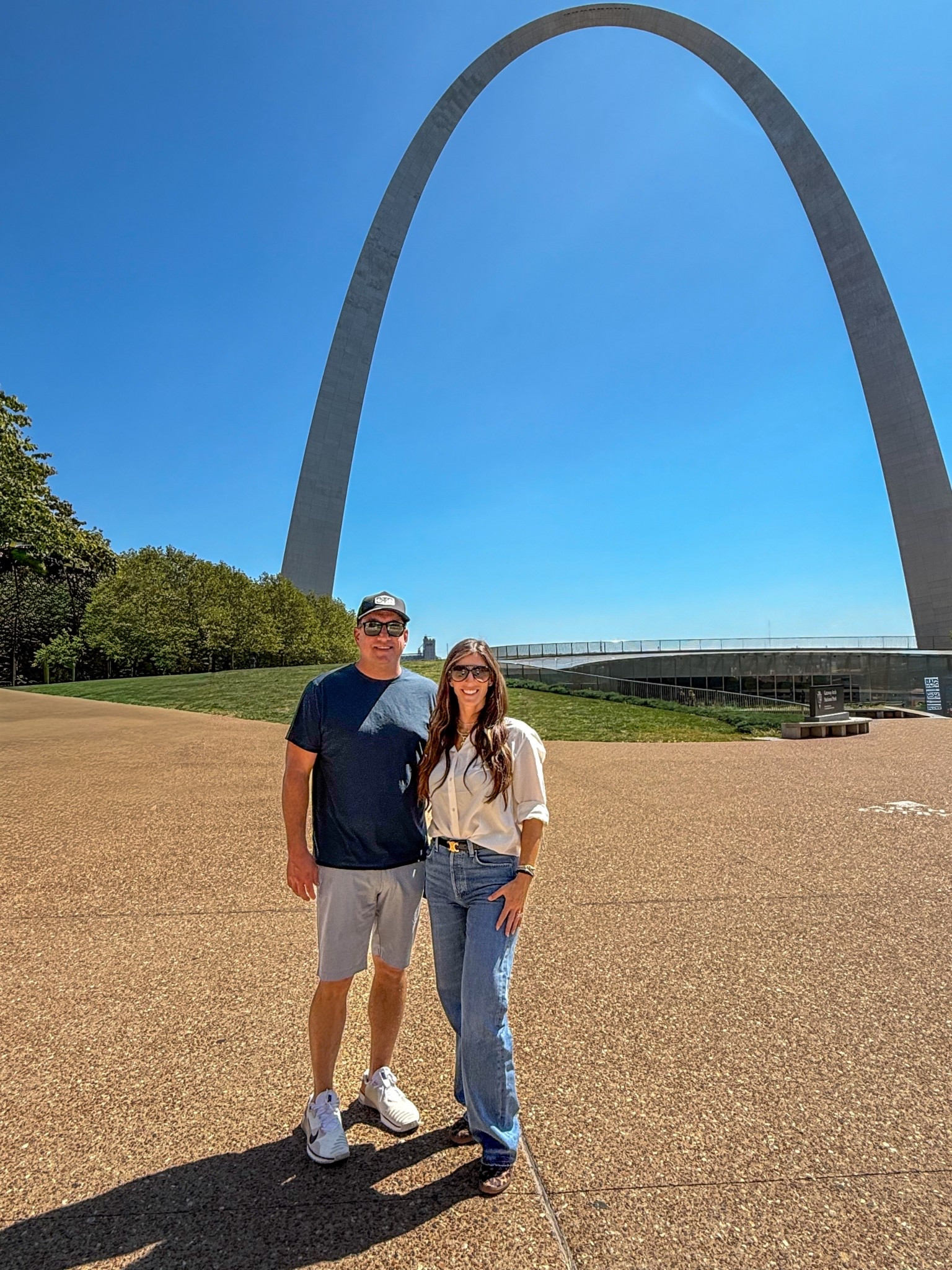 Exploring St. Louis.  A day at the iconic Gateway Arch in classic casual style.

Outfit Details: ivory button-down blouse (tucked + tied), straight-leg high-waisted jeans, black belt, layered gold necklaces, oversized sunglasses, brown sandals, crossbody bag

#StLouisStyle #GatewayArch #WeekendGetaway #TravelOutfit #OOTDinspo #CasualChic #FallTravelStyle #WomensCasualStyle #EffortlessStyle #LTKwomensfashion #LTKtravel #LTKstyletips #LikeToKnowIt