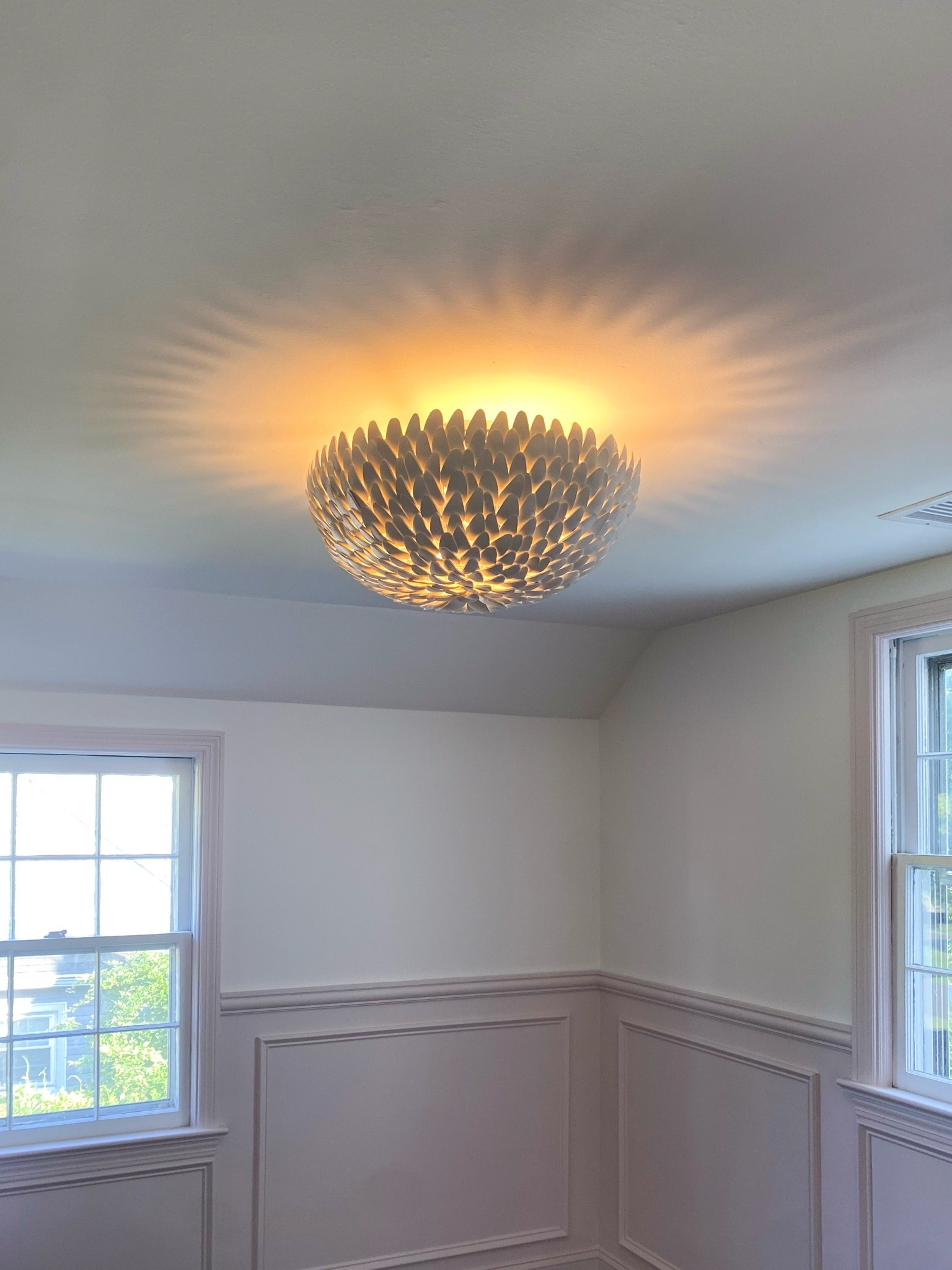 This ceiling light adds such a pretty statement without overwhelming the room. The sculptural shape gives off the prettiest glow and adds a little personality to this classic space.

ceiling light, flush mount light, statement lighting, home decor, dining room ideas, bedroom lighting, classic interiors, transitional home, modern traditional style, cozy home, interior design ideas, girlonthehudson

#LTKKids #LTKHome #LTKSeasonal