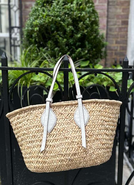 The perfect structured raffia/woven tote from Pamela Munson. I love that it’s under $300 and doesn’t have a big logo or branding. And it holds up so well - I’ve had this for 2+ years and it’s still in great condition  

#LTKitbag #LTKSeasonal
