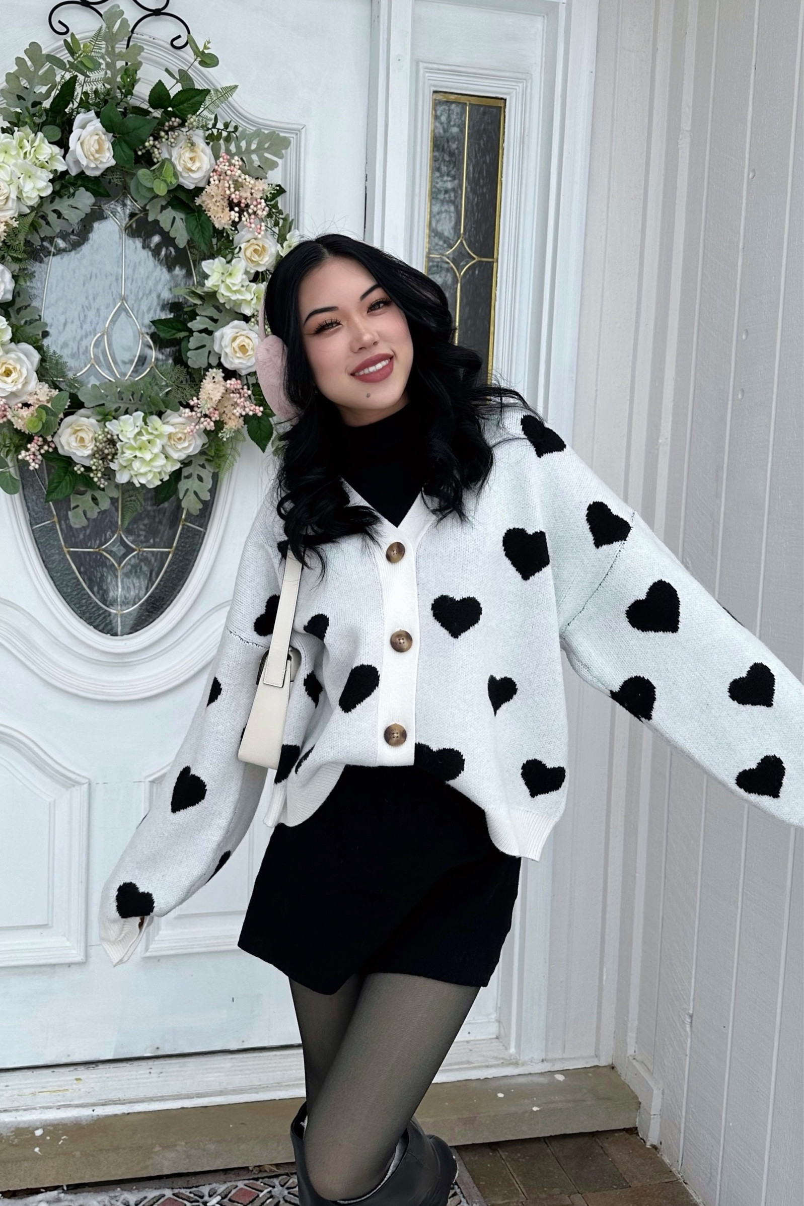 Valentine’s Day inspired outfit with heart printed cardigan, black turtle neck, black mini skirt, fleece tights, heart war muffs and knee high boots 

#LTKSeasonal #LTKstyletip #LTKGiftGuide