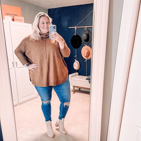 This gorgeous tunic turtleneck sweater is easy to style with my favorite skinny ankle jeans and boots. This sweater come in both regular and plus sizes and is only $18 and comes in several colors. It’s so soft and cozy - perfect for cooler temps. 

Sweater weather | ootd | plus size | Walmart | Walmart finds | abercrombie | ripped jeans | lug sole boots | curvy 

#LTKcurves #LTKshoecrush #LTKSeasonal