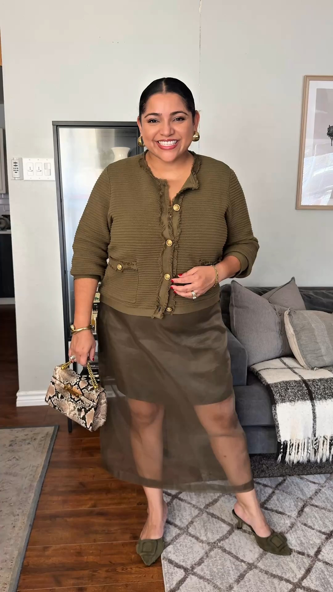 Experimentingwithdecor is wearing an olive green sheer skirt, paired with a olive green cardigan perfect for a workwear fit. She paired this midsize outfit with these Manolo inspired green kitten heels. Added gold accessories and a inexpensive snakeskin bag that she modified taking off the strap and adding an Amazon gold chain. 

#LTKPetite #LTKShoeCrush #LTKMidsize