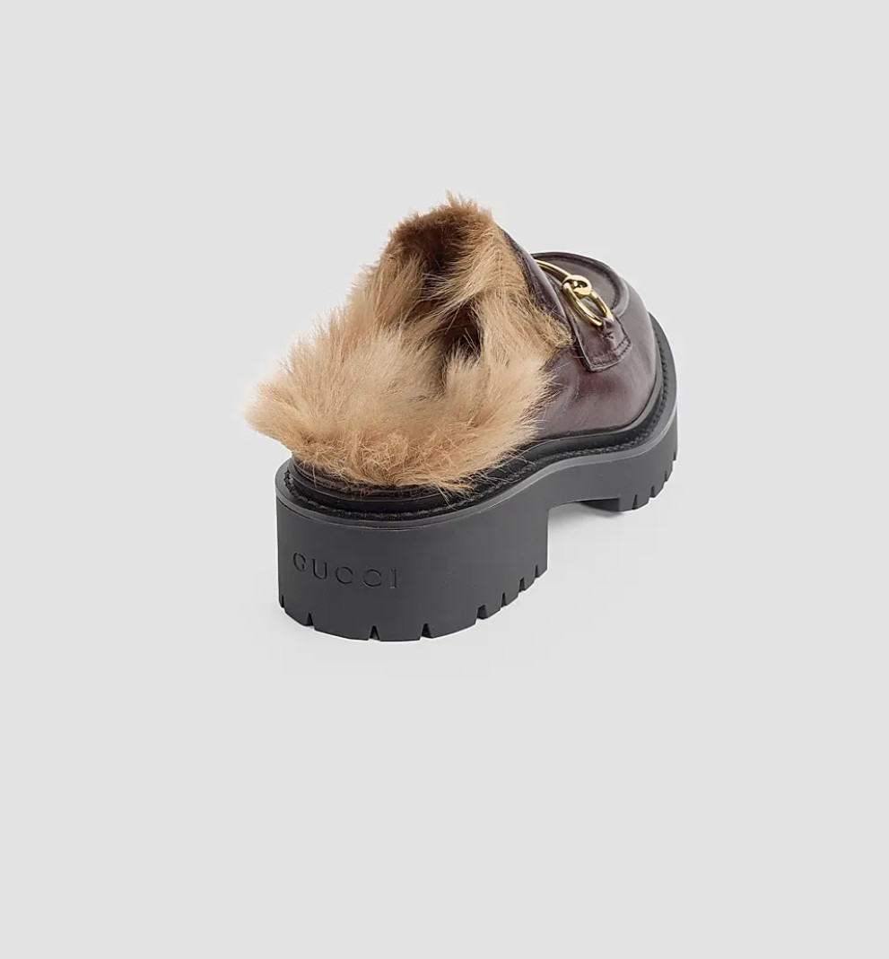 Tired of choosing between cozy shoes and a polished outfit? The Gucci Rhodi Leather & Shearling Horsebit Mules combine luxe leather, plush shearling, and iconic horsebit detailing for an elevated take on comfortable slip-on shoes. Perfect for fall outfits, travel days, brunch, shopping, or chic everyday looks, pair them with denim, trousers, leggings, or cozy knits for effortless designer style. 

 #LTKootd #LTKvlog #LTKOver40
