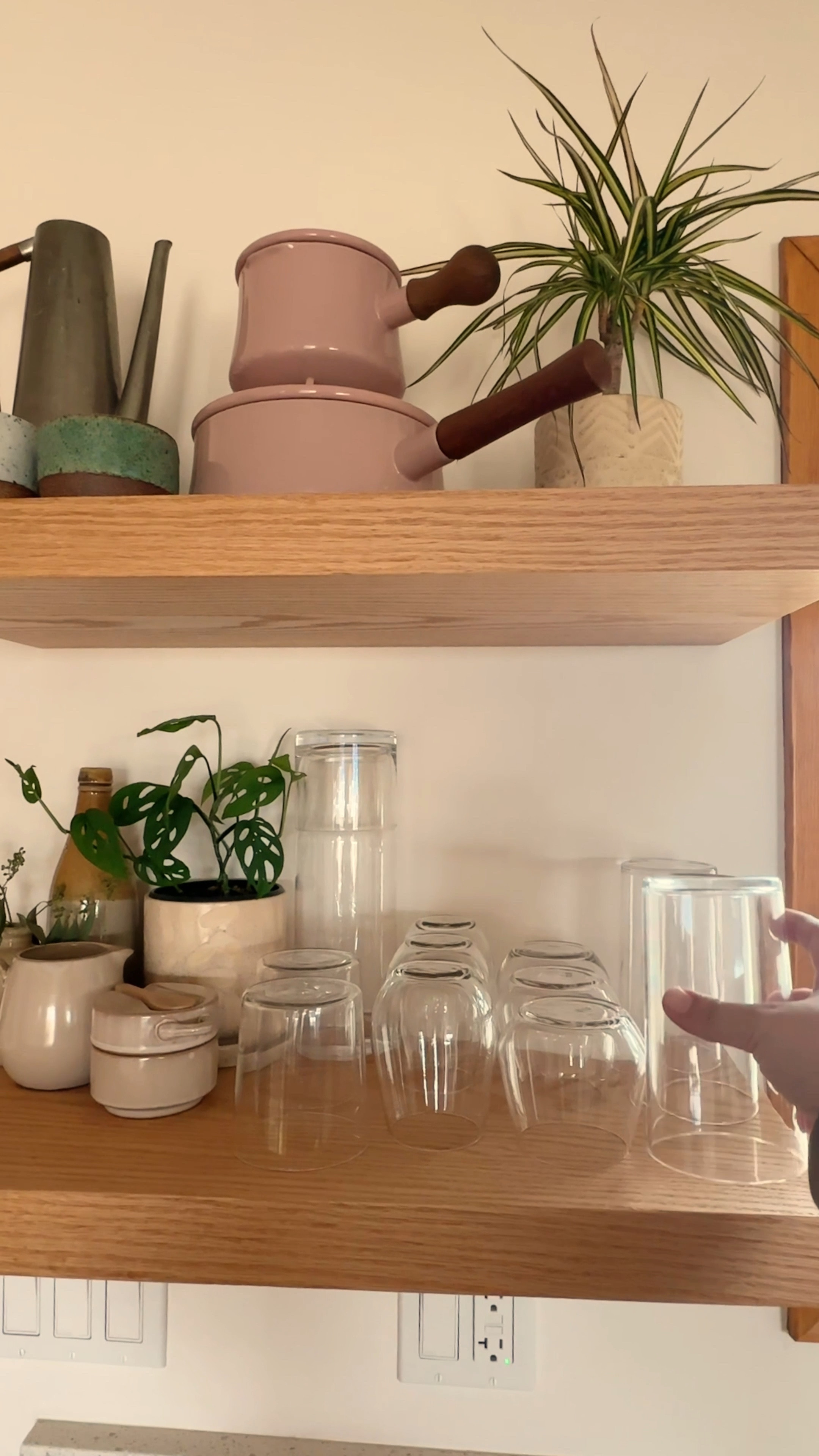 We always knew we didn’t want upper cabinets in our open-concept kitchen. Floating shelves helped create a lighter, more open storage solution that doubles as wall decor. 💁‍♀️

To cultivate coziness in the living room, even with the kitchen only feet away, we designed a space with minimal open-shelving that continues from the Kitchen into the Dining Nook. Combined with matte white cabinetry, and a white glass fridge, we were able to keep things light enough to blend in with our walls. Now the kitchen melts away into the rest of the room and creates a beautiful, functional space we enjoy daily ✨
#kitchendesign #openconceptkitchen #openshelving #kitchendecor #shelfstyling #kitchen 

#LTKhome
