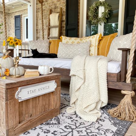 Early fall has arrived on the front porch. I added texture through cozy throws and pillows. The muted yellow color palette combined with cream and wood is perfect to transition from summer to fall.

#LTKSeasonal #LTKhome