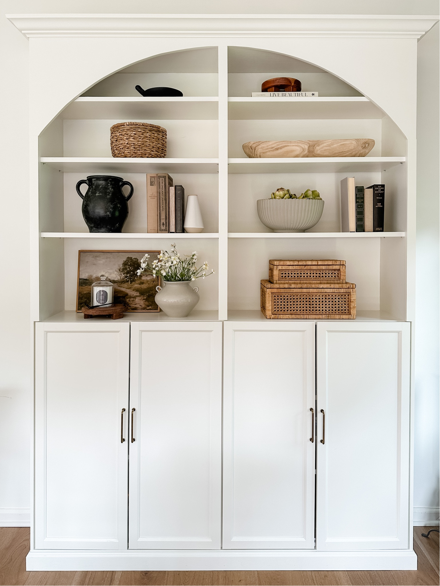 One of my favorite home projects is our Ikea hack arched cabinet. We used two 36 inch billy bookcases and the Oxberg doors and a little DIY magic to make it look like a built in! Most of the shelf decor linked here too. 

#LTKhome #LTKstyletip #LTKunder100