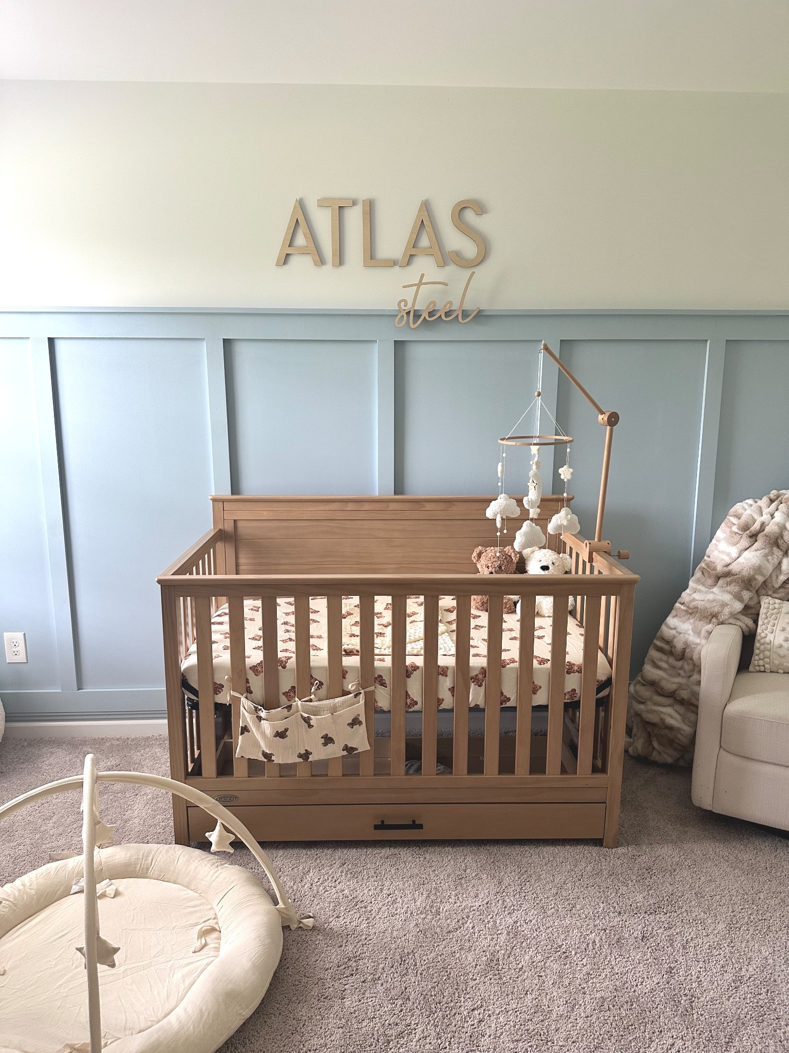 Boy nursery with board and batten accent wall and wooden name sign 

#LTKKids #LTKBaby #LTKFamily