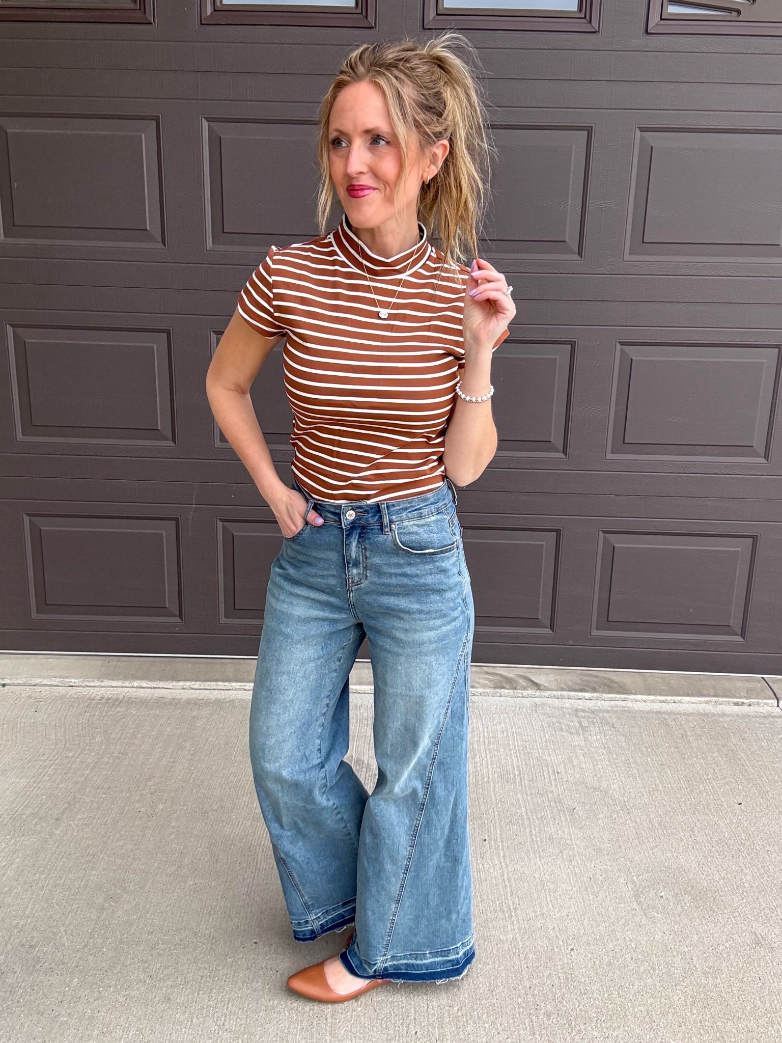 This brown striped mock neck short sleeved top is so cute! 🤎 Loving this casual vibe with the wide leg denim. Wearing a small in the top and 4 in the denim.

As an Amazon Influencer I earn commission on qualifying purchases.

Striped top, mom style, spring fashion 2026, casual denim look, flare denim, light wash denim, brown top

#LTKMidsize #LTKootd #LTKOver40