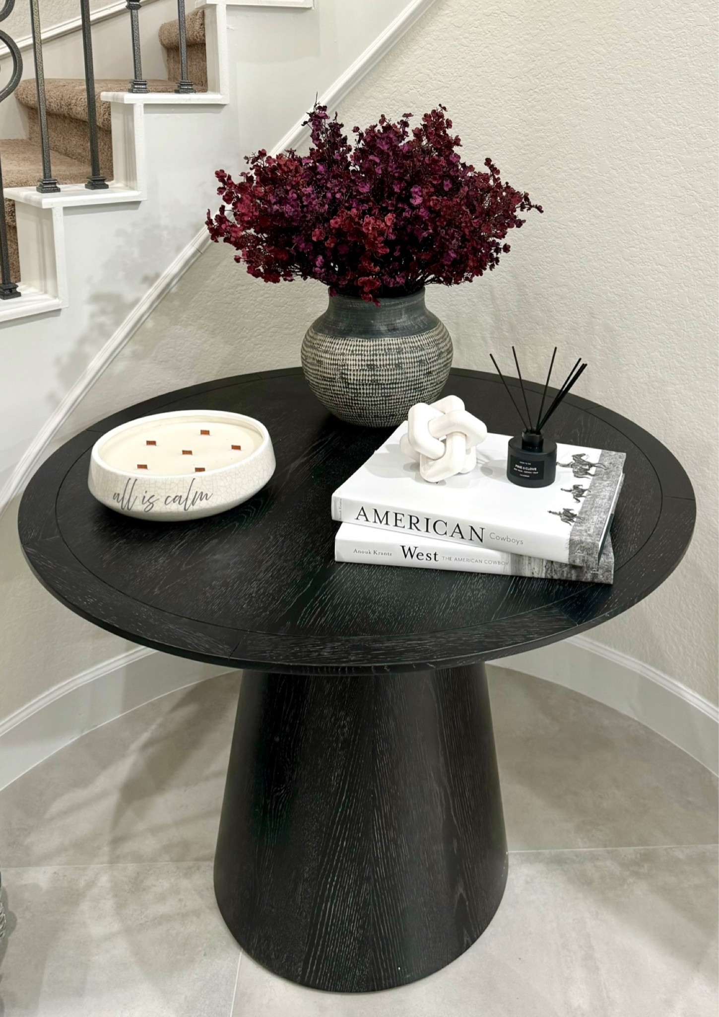 Decor idea for under stairs. Round table, decorative books and a big candle. 

#LTKhome #LTKfindsunder50 #LTKstyletip