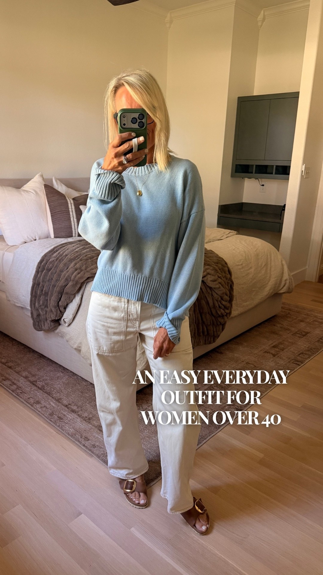 A light blue sweater and white jeans might be one of my favorite effortless outfit combinations. I love how this relaxed knit sweater pairs with ecru barrel jeans for a look that feels polished without trying too hard. Add a simple gold necklace and brown sandals, and you have an easy everyday outfit for lunch dates, errands, or a casual day out. Current sandals I’m wearing are out of stock so I’ll be tagging another shoe option that works just as well with this outfit! 
Save this blue sweater outfit idea for the next time you’re wondering what to wear!