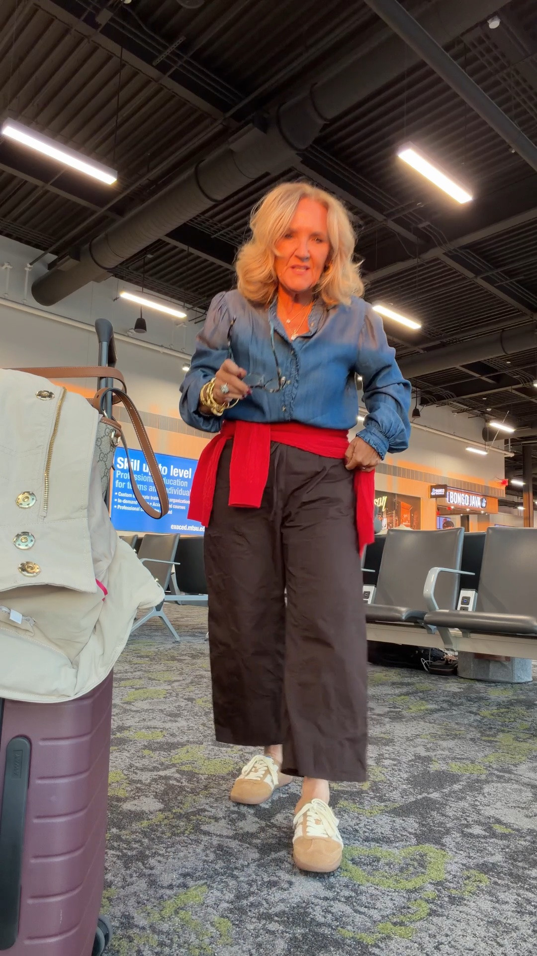 Travel outfit today. Quick hop to Texas. 
Chambray Tencel blouse medium 
Poplin drawstring pants size small yes size down 
I’ll link a few red sweaters 
It’s going to rain in Texas. Bringing my raincoat! I wear the petite medium

#LTKOver40 #LTKootd #LTKTravel
