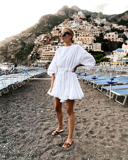 Fashion Jackson wearing white beach dress (small), sandals, vacation outfits, spring outfits, resort, Italy, #vacationoutfits #whitedress #sandals #fashionjackson 

#LTKunder100 #LTKSeasonal #LTKstyletip