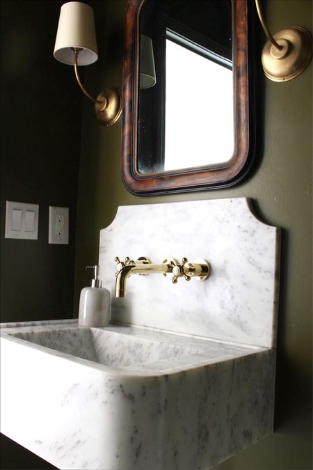 Powder room with marble sink brass fixtures green walls

#LTKhome