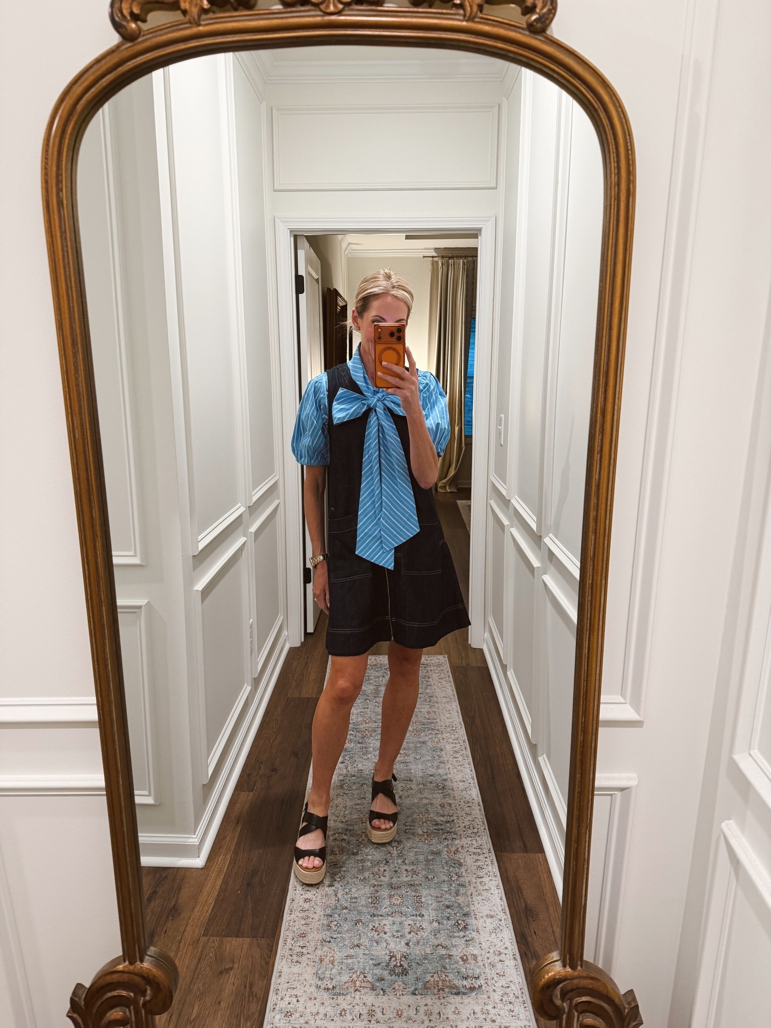 Today’s outfit of the day is this little extra Fun bow blouse that delivers the wow size extra small over this denim classic zip up dress both under $30. Wearing an extra small in both.