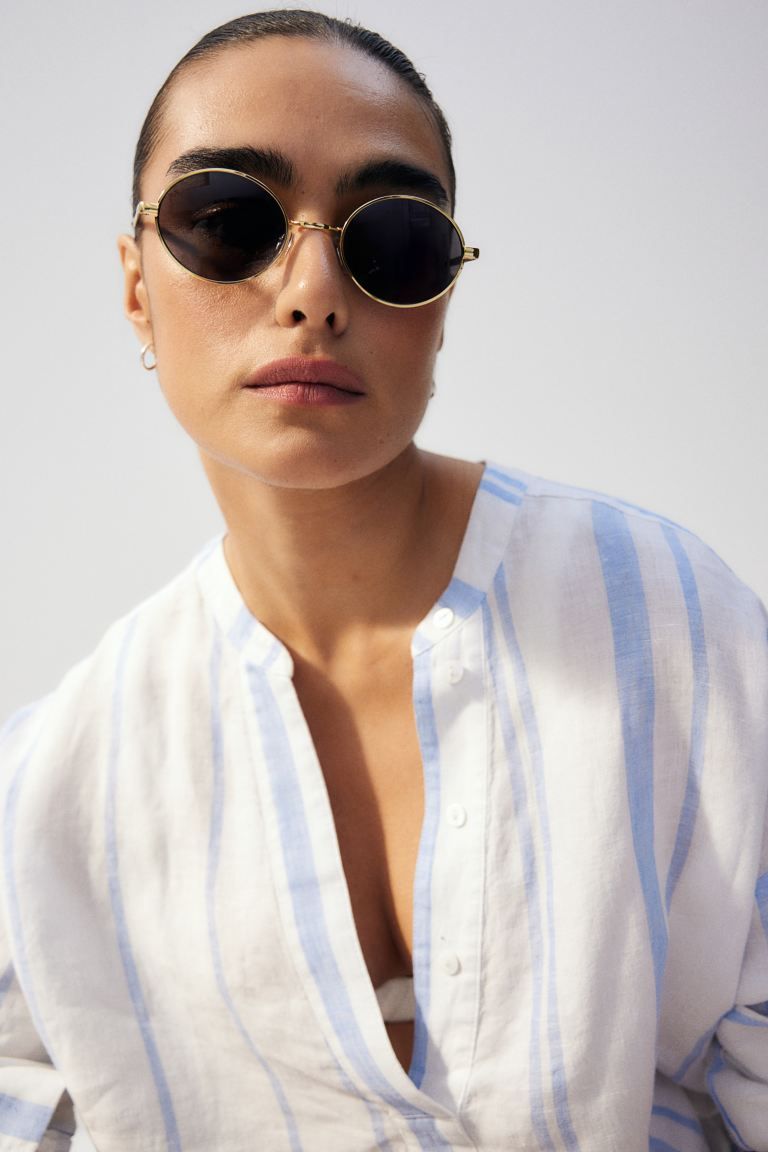 Oval sunglasses - Gold-coloured/Black - Ladies | H&M GB | H&M (UK, MY, IN, SG, PH, TW, HK)