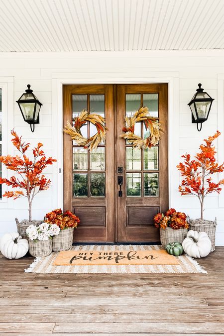 Front porch and door decor fall autumn harvest seasonal entry French double doors oversized layered scatter rug and doormat pumpkin magnolia trees faux artificial silk florals mums baskets wreaths outdoor lanterns wall sconces rocking chairs light fixtures southern modern farmhouse style home decor nearly natural amazon finds Etsy wayfair marshalls TJ Maxx home goods Walmart autumn oak trees 

#LTKhome #LTKSeasonal #LTKHalloween