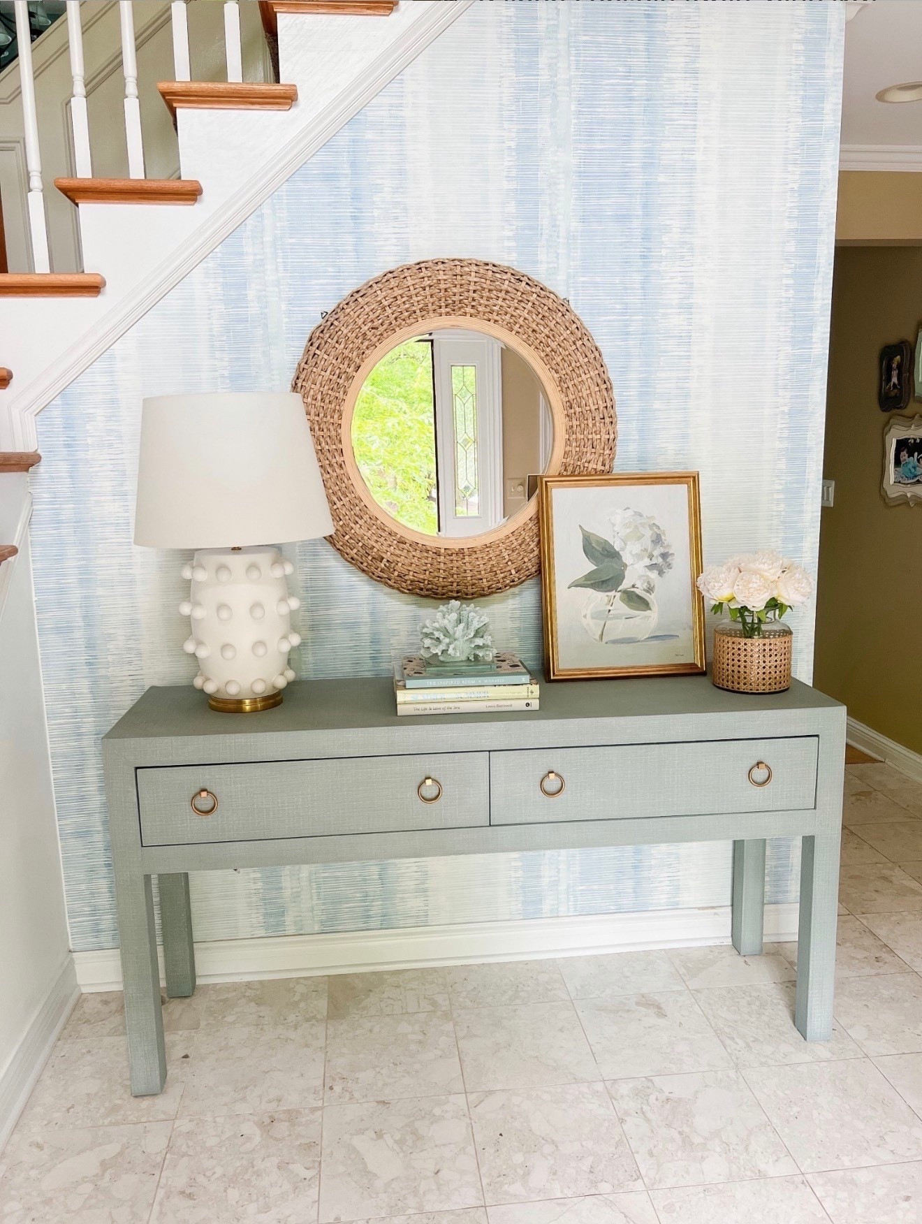 This coastal linen console table paired with blue wallpaper creates a classic coastal entryway look that feels timeless and elevated. I love how the soft texture and layered blues make the space feel bright and pulled together. 

#LTKU #LTKHome #LTKSaleAlert