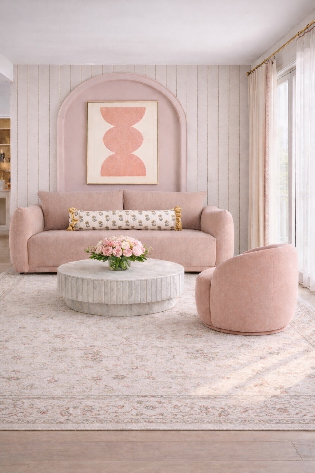 April begins in blush — soft, grounded, and quietly full of promise.

There’s something about this color that feels like a reset. Not loud, not demanding — just a gentle shift. Blush carries that early spring energy… the kind that feels fresh but familiar, romantic but still composed. It’s the in-between moment — where everything starts to bloom again, but in the most effortless way.

That’s exactly the direction behind this living room.

A blush pillow sofa anchors the space with warmth, layered with a soft patterned pillow that adds just enough texture without overwhelming the palette. Above it, the blush artwork echoes the tone in a more sculptural, modern way — subtle, but intentional. And that curved blush accent chair? It’s the quiet statement piece that completes the conversation without trying too hard.

What really brings everything together is the softness in the layers:
– a floral rug that feels like spring underfoot, delicate but grounded
– tailored pleated drapes with the most beautiful pink trim, catching light in the gentlest way
– a low floral arrangement that keeps the table feeling styled, not staged

Nothing here is overpowering. It’s all about balance — softness with structure, romance with restraint.

Blush isn’t just a color for me this April — it’s a mood.
A way to slow down, reset, and design with intention again.

#pillowsofa #artwork #pillow #floralarrangement #drape #livingroomdesign #blushdecor #springrefresh #homedecor #neutralpalette #interiordesign #cozyhome

#LTKSaleAlert #LTKFestival #LTKHome