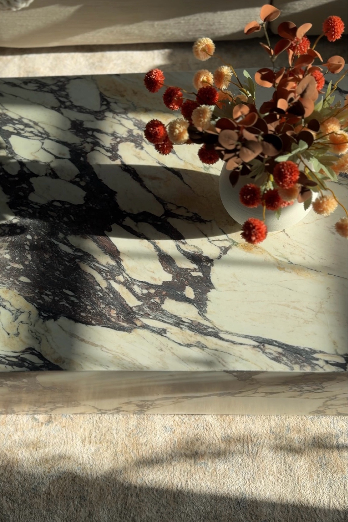 The prettiest coffee table I ever did see. 


Marble coffee table, fall decor, fall stems, neutral rug 

#LTKHome