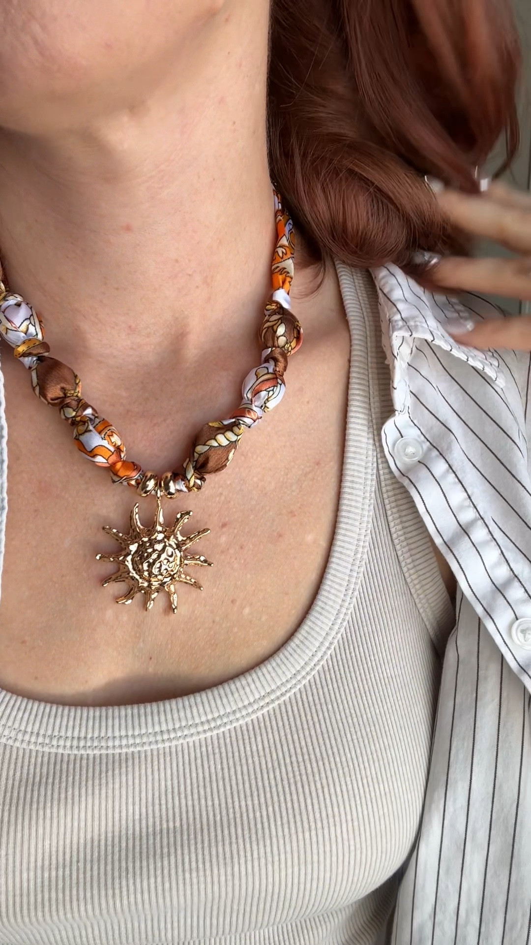 The prettiest gold and orange scarf necklace with sun adornment 😍☀️🧣!
From Amazon, Fauthenticute is the brand, and I have several of their jewelry pieces and LOVE them! 

#LTKgrwm #LTKFestival #LTKootd