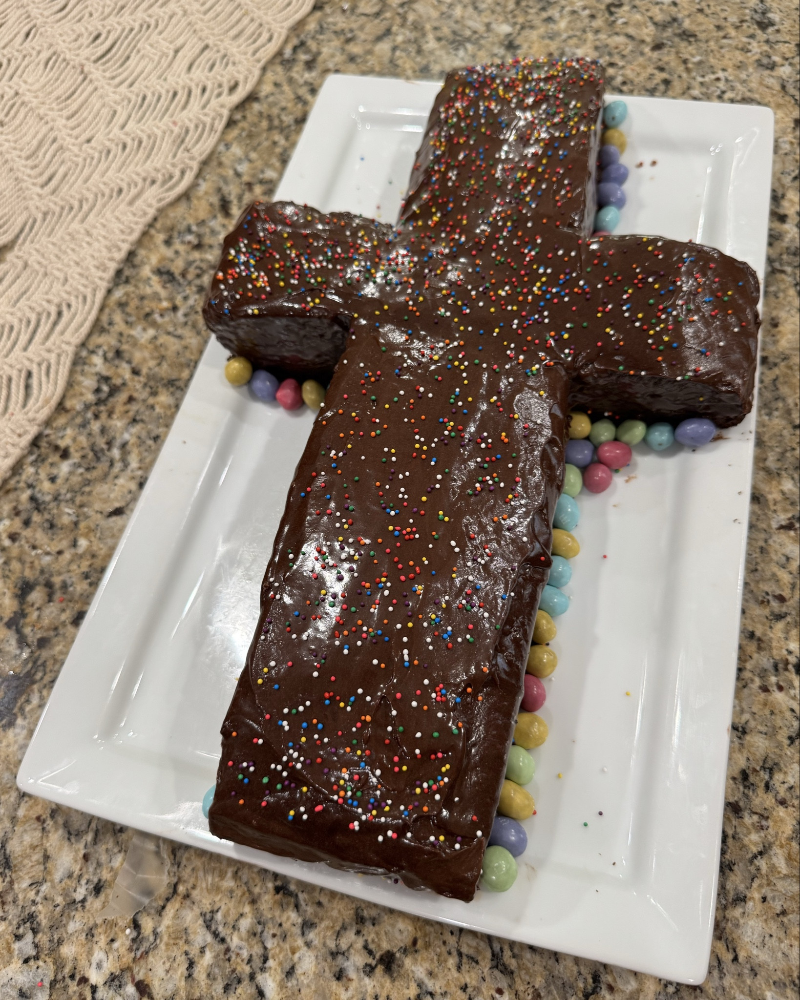 Easter dessert ✝️

Chocolate cross cake for the win 🙌🙌🙌 
Tis the reason for the season 🤍

This isn’t very hard and such a great centerpiece for the dessert table. Just make your favorite 9x13 cake and cut it in half long ways (hot dog) then cut one of the sides in half again, then one of those halves you cut again. The two smaller squares of the cake are the sides of the cross, the longer side you didn’t cut is the bottom base and that other piece is the top :) 
I’ve included the Pinterest picture I used for the cutting direction. 
Then cover in icing so it looks even nicer. :) 
This was such a hit! Especially with the kiddies! 

I added some egg candies (m&ms) along the sides to spice it up and cover my edges 🤗

For the cake recipe I used: 
1 box of brownie mix
1 box of devils food choc cake mix 
4 eggs
1 cup oil
1 1/4 c water 

#LTKSeasonal #LTKHome #LTKfoodie