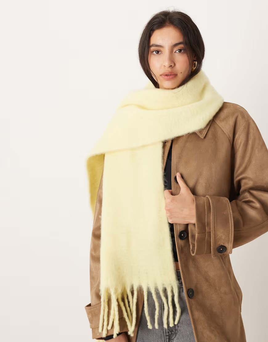 ASOS DESIGN woven fluffy tassel scarf in buttermilk yellow | ASOS (Global)