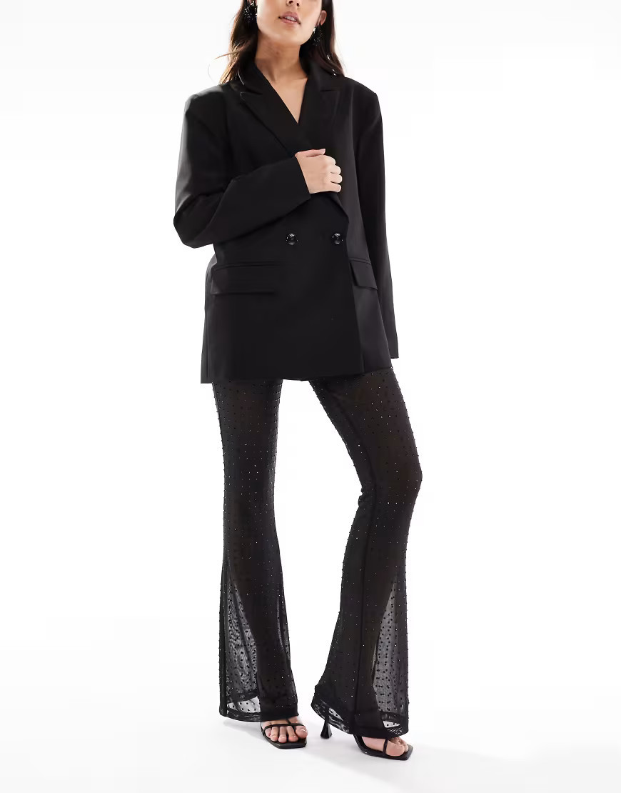 ASOS DESIGN rhinestone sheer mesh flare pants in black | ASOS (Global)