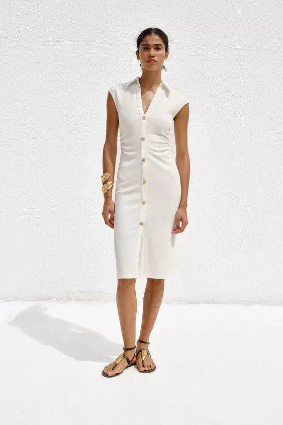 Short sleeve midi shirt dress with a v-neck and draped side detail. Metal button fastening at the... | Zara UK