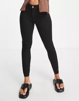 River Island Molly mid rise reform skinny jeans in black | ASOS (Global)