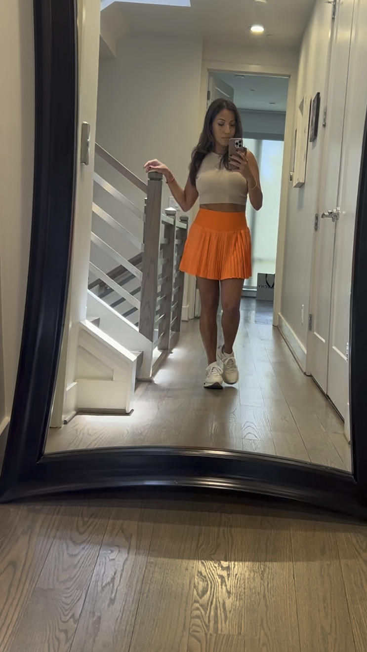 🍊 Squeeze the day in style! 🧡 Elevate your summer wardrobe with this vibrant orange tennis skort, chic tan crop top, and playful sneakers. #FashionForward #TennisChic #SummerStyle

#LTKfitness #LTKstyletip #LTKActive