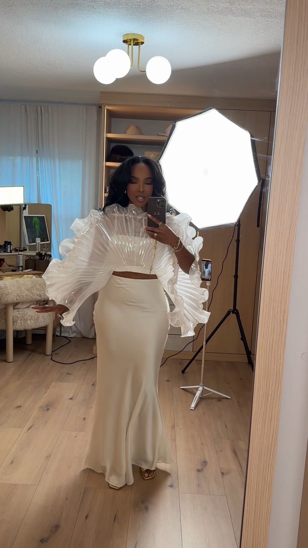 Statement elegance at its finest 🤍

This sculptural two-piece moment is all about drama without being overdone — the pleated ruffle top paired with the sleek skirt creates that high-fashion, editorial feel while still being wearable. A timeless look that instantly elevates your closet and feels special every time you put it on. Definitely one of those pieces where the cost per wear drops with every event.

Perfect for weddings, formal dinners, special occasions, and upscale celebrations.

📏 Sizing: Top (Small) • Skirt (Small)  
Measurements: 5’4” · 138 lbs · 34D · 27” waist · 40” hips

Save this post for your next elevated outfit moment and tap to get details.

Follow me on Instagram and YouTube @kirasfashionfinds

#LTKgrwm #LTKootd #LTKvlog