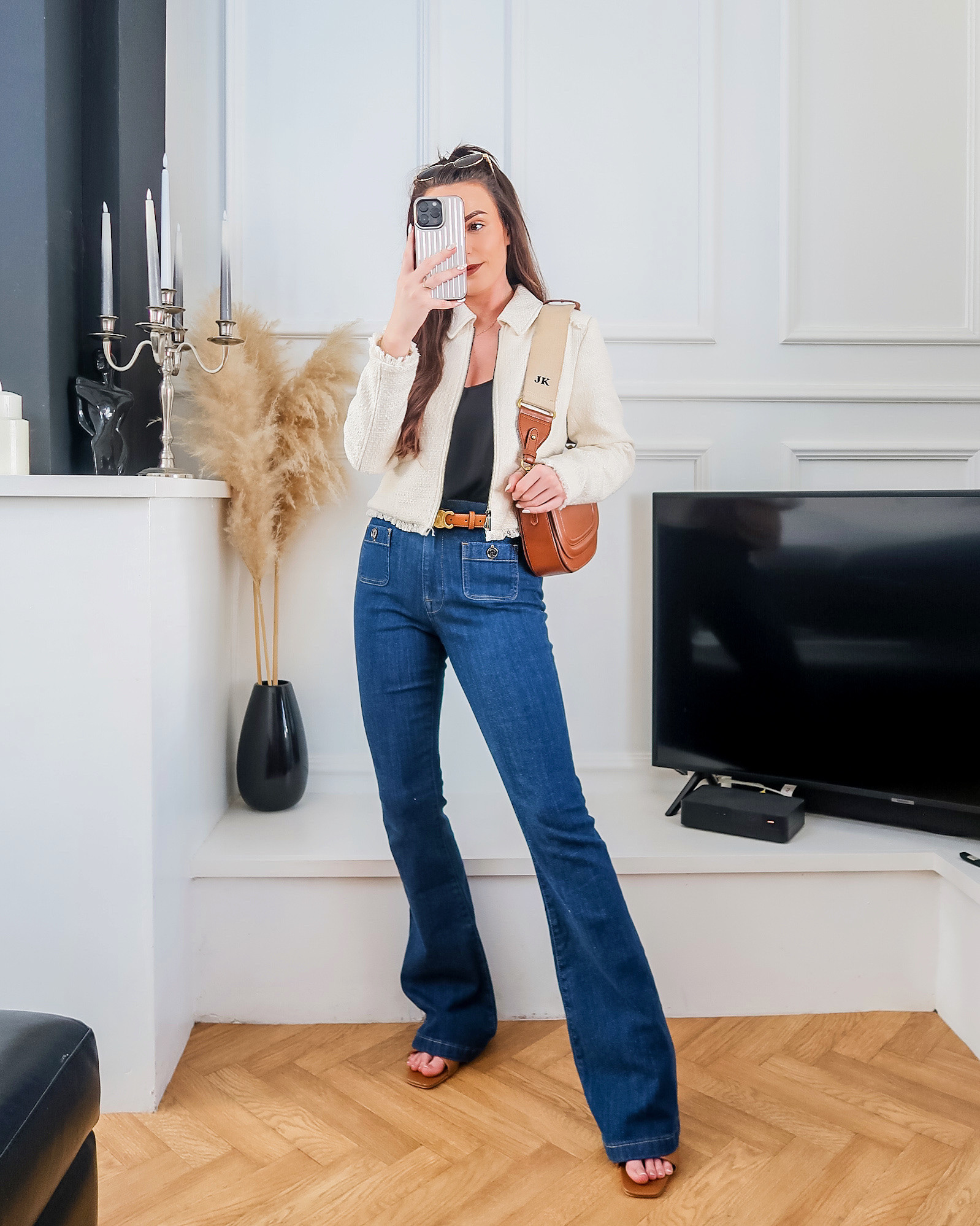 Wednesday fashion, midweek outfit, boucle cropped jacket, chic workwear, flare denim outfit, Saint + Sofia style, high-street luxe look, spring fashion UK, tailored spring outfit, tan accessories style, blue denim kick flare jeans, cream Boucle jacket, black chiffon cami top, tan bag, tan heels, tan sandals 

#LTKuk #LTKspring #LTKeurope