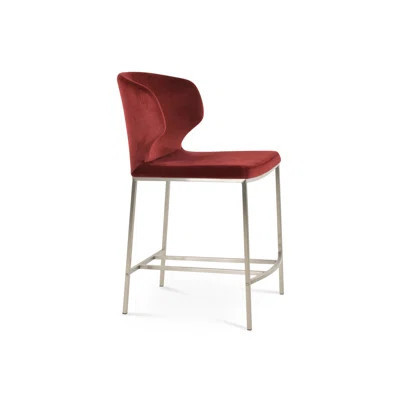 Red velvet counter stool with sculptural back and stainless steel frame