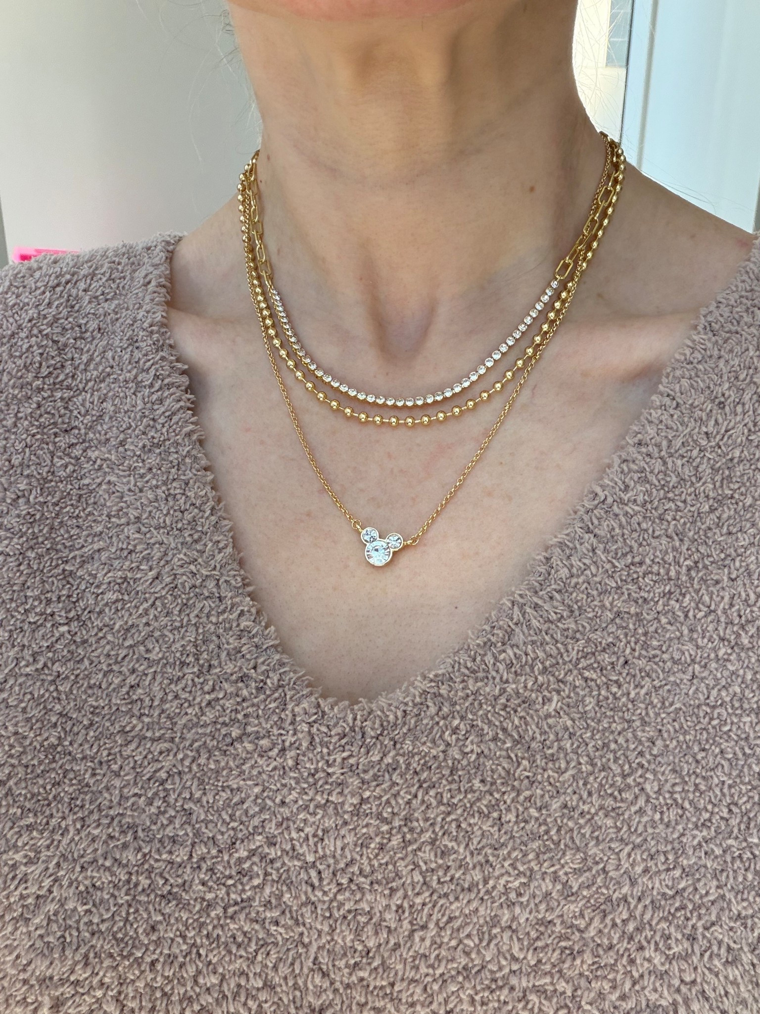 Adorable layered necklace for Disney, gold chains, all in one easy fashion for Disneyland or Disney World, on sale now! Baublebar! So pretty 

#LTKValentine #LTKTravel #LTKSaleAlert