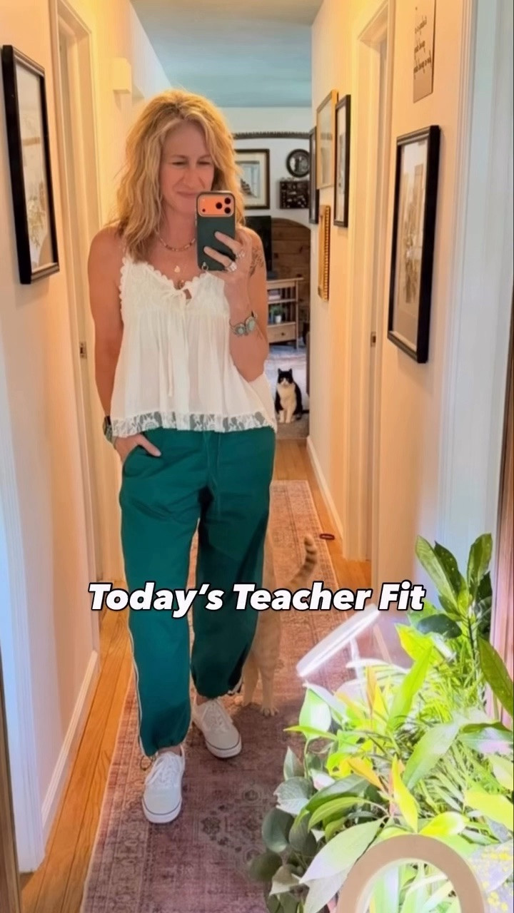 Has anyone else noticed the explosion of those flowy little babydoll tanks on Amazon lately? Because honestly… I get it now 😂

This airy top might officially be my new favorite. I paired it with relaxed track pants, mint green Vans & way too much jewelry today… but I was feeling the teal tones in the pants & just kept going with it. Also… gold & silver together forever. I refuse to choose sides at this point.

Meanwhile… hair appointment this week 👀
The grow-out situation is definitely getting more noticeable now & I’m starting to really see what I’ve apparently been covering up all these years. Weirdly enough… I’m not hating it. SO FAR. Lol.

Also… 4 day week 🙌
& only 15 class days left after today which honestly feels fake.

Holy crap. We got this.

#FlutterByMethod #TeacherStyle #MidlifeStyle #LTKFinds #TeacherOOTD

Teacher outfit details: babydoll tank • track pants • mint green Vans • layered jewelry • casual teacher outfit • comfy summer style • Amazon fashion find • relaxed midlife style

#LTKgrwm #LTKootd #LTKmorningroutine