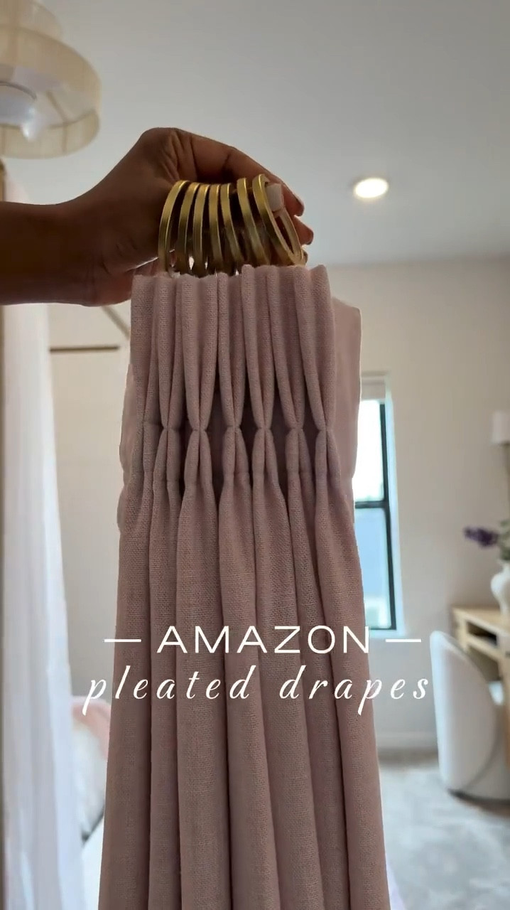 I'm absolutely in love with how  my daughter Michelle's room drapes turned out 👌🏾…..I've also got the same drapes in our guest room and great room.

Like many of you, I received a hefty quote for drapes a few years ago - 10K to be exact…..and that was just for three windows. 😅 I mean, who doesn't love the look of custom drapes? I particularly love the pinch pleat - it's my favorite. 😍 

One thing to keep in mind with this system is that you'll need to account for roughly 6 inches of slack. 🤎 So if your ceiling height is 108 inches, you'll need to order 102-inch drapes if you want to hang the rod at the very top and have the drapes ""kiss"" the floor. Thanks to hubby for helping me figure out precision & measurements. Shop now and  transform your home.#LTKStyleTip 

#LTKSaleAlert #LTKHome
