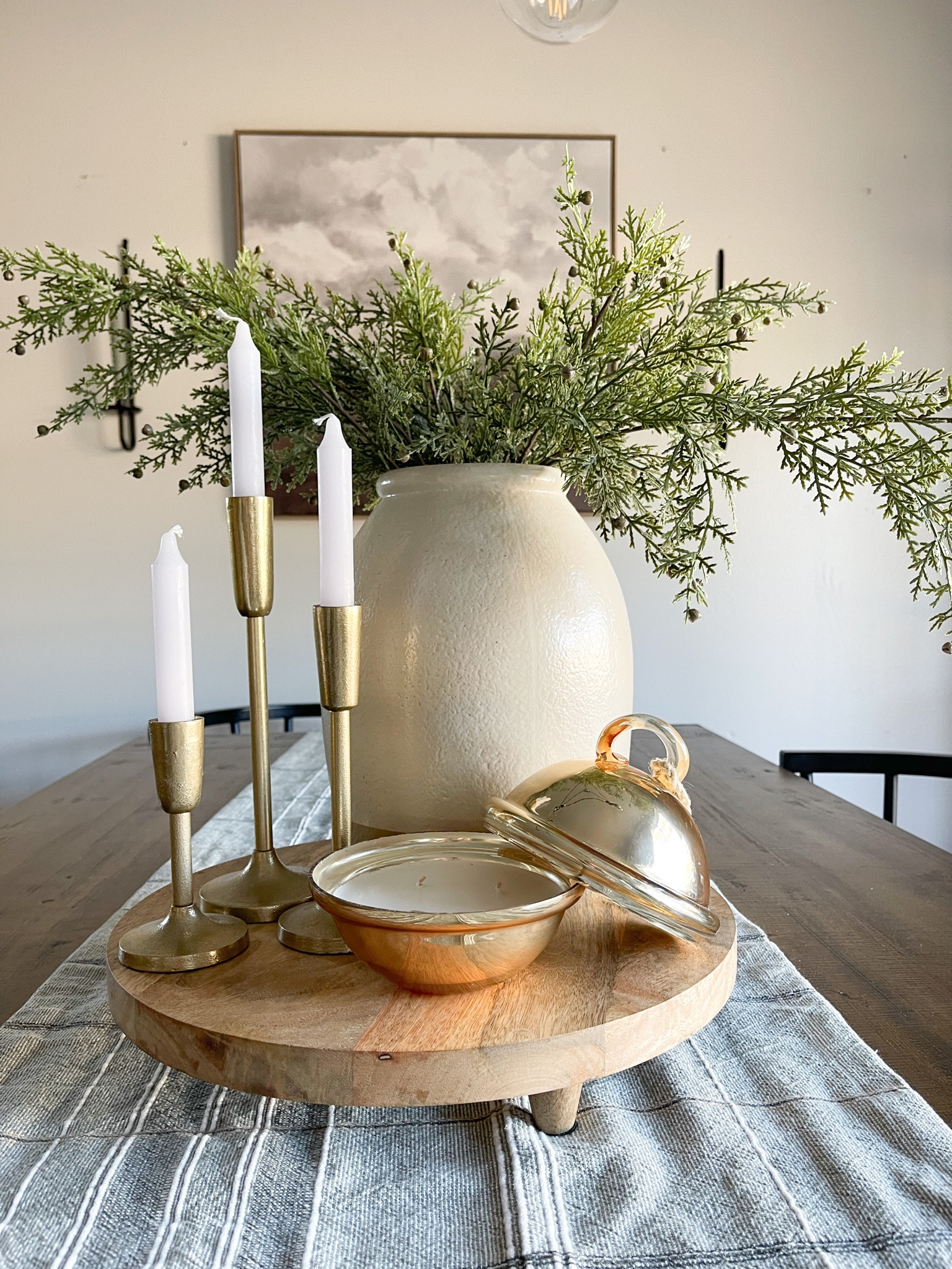 Christmas centerpiece. Christmas table decor. Gold ornament candle. Pottery barn candle. Gold candle sticks. Christmas greenery. Large vase. Holiday decor. Neutral Christmas table decor. Green table runner. 

#LTKHoliday #LTKhome #LTKstyletip