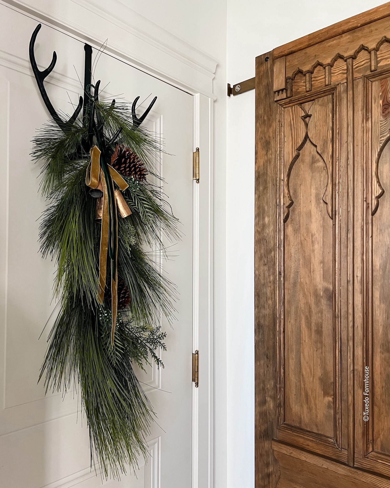 How about a holiday swag on your door? It works so good with this  antler wreath holder. My door is linked as well  

#LTKSeasonal #LTKHoliday #LTKHome