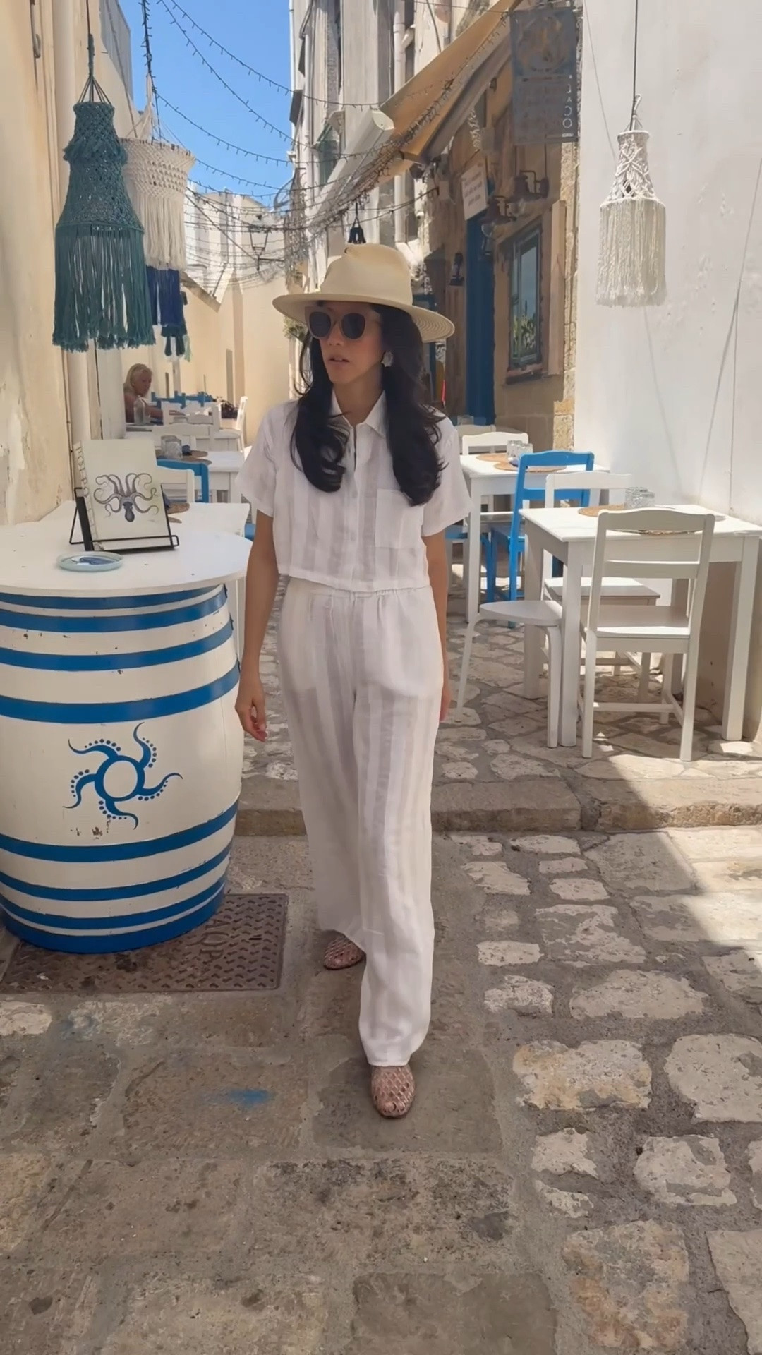 Outfit of the day: Cropped white linen shirt and matching linen pants plus jelly flats and a wide brim hat to walk around in Gallipoli

#LTKTravel #LTKootd #LTKOver40