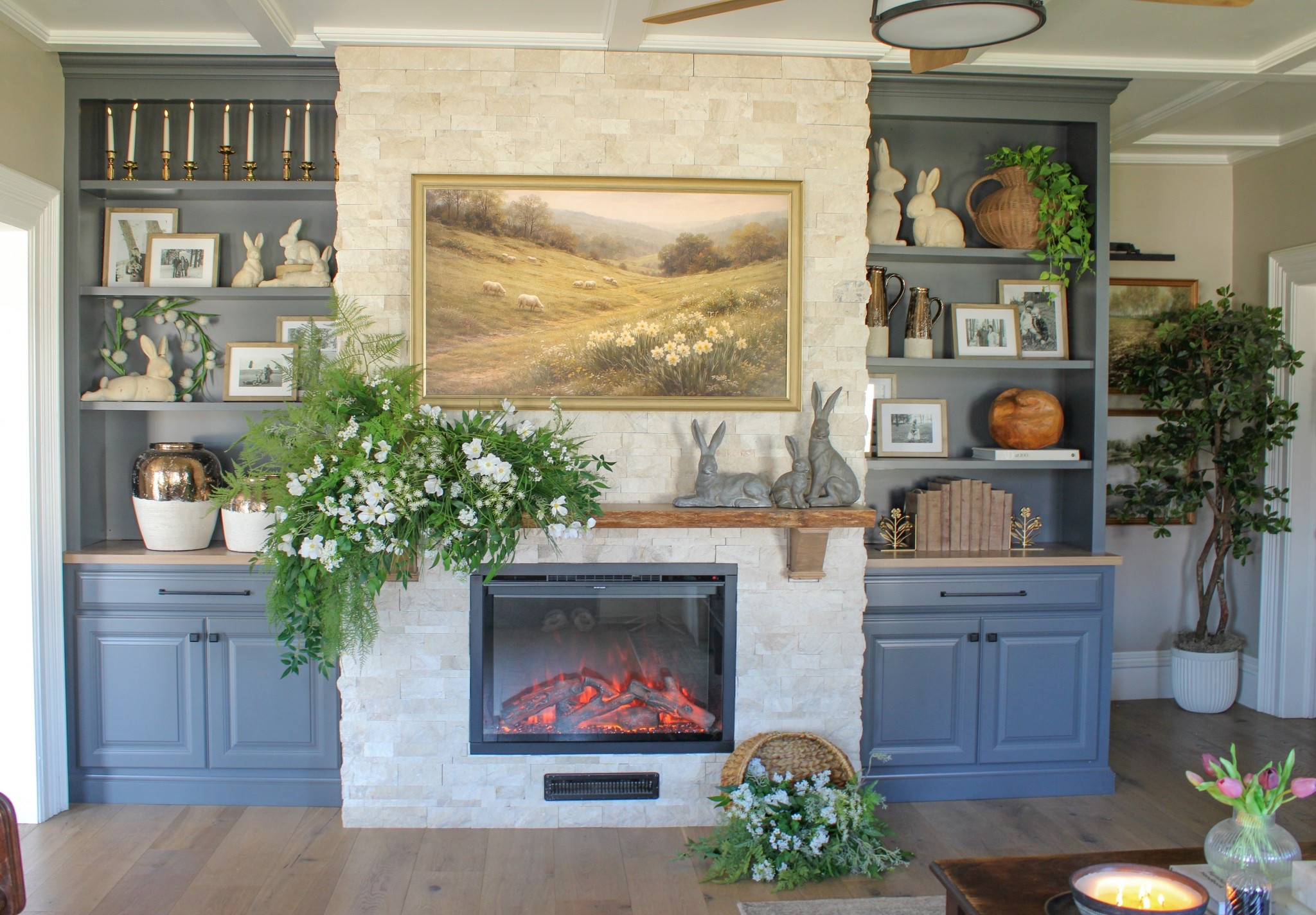 My favorite view from the couch. Spring built in styling | Spring Mantle | Floral Arrangement | Vintage Modern Decor | 

Samsung Frame TV | Deco Frame | Vintage Candle Holders | Stone Resin Rabbits | Easter Decor | Wicker Vase | Spring Greenery | Bookshelf Styling |

#LTKHome